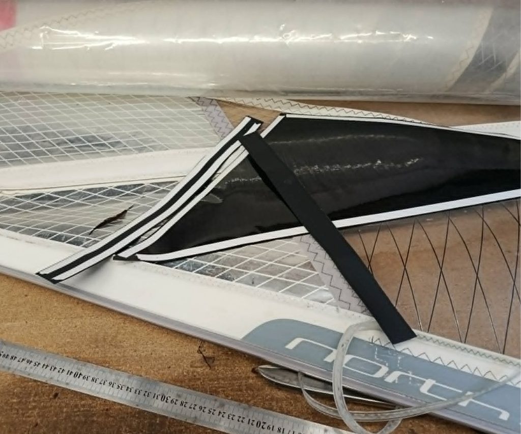 Windsurf sail window replacement during repair